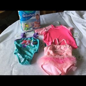 New 6-9 mo 2 swim suits, cover up, swim pampers